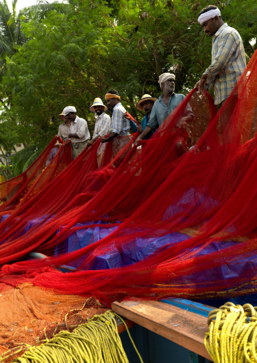 Mahe Fishermen Lining Up Their Red Nets, India