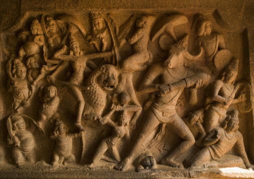 Bas Relief Of The Goddess Durga Riding A Lion Fighting Mahishasura, The Buffalo Demon  At Mahishasuramardhini Cave, Mahabalipuram, India