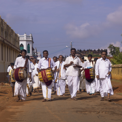 Group Of Musician Men Dressed In White In Procession During A Wedding With Nadaswaram And Thavil In Kanadukathan Chettinad's Street, India