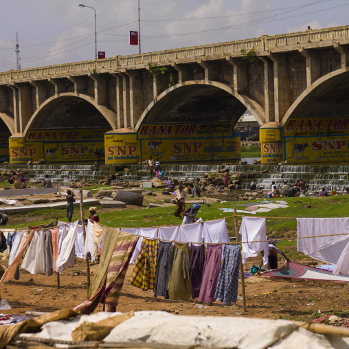 People Washing And Putting Dry Clothes Under A Painted Bridge, Madurai, India