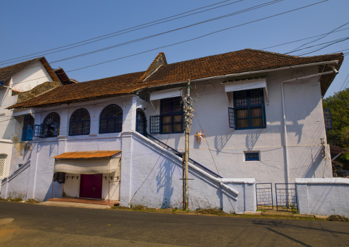 Front Of A Old White House With Blue Windows, Kochi, India