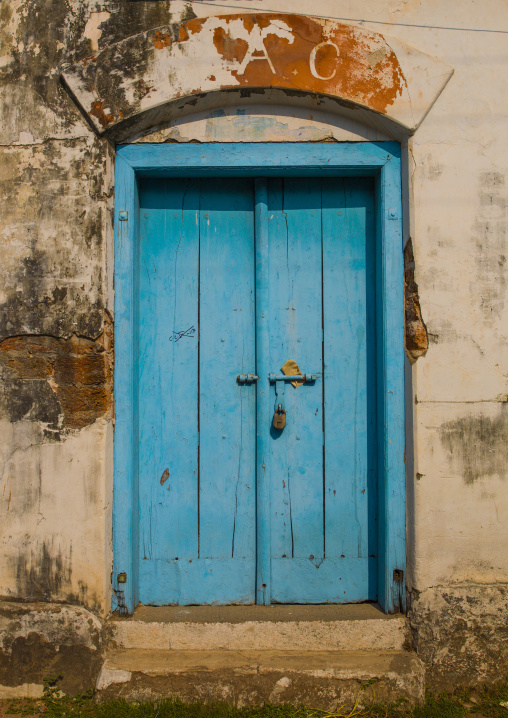 Old Blue Wooden Door With A Padlock Surrounded By Decrepit Walls, Kochi, India