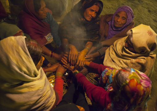 Women Putting Hands Over A Fire, Maha Kumbh Mela, Allahabad, India