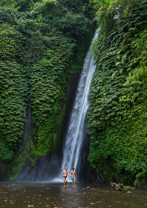 Tourists Having A Bath In Munduk Waterfall