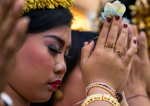 A Teenager Girl In Traditional  Costume Praying Before A Tooth Filing Ceremony