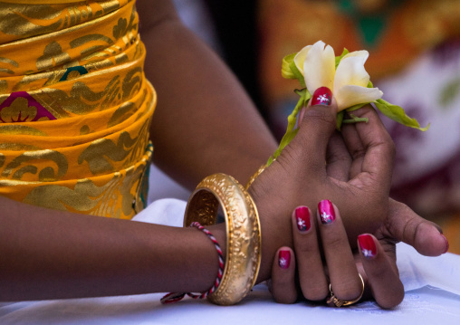 A Teenager Girl With Flowers In The Hands In Traditional  Costume  Before A Tooth Filing Ceremony