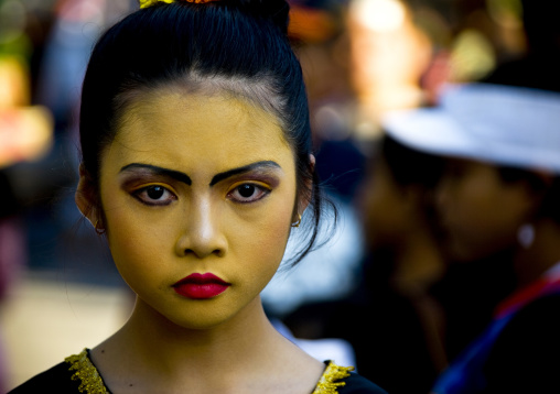 Girl With Yellow Make Up On The Face During A Festival, Mataram, Lombok Island, Indonesia