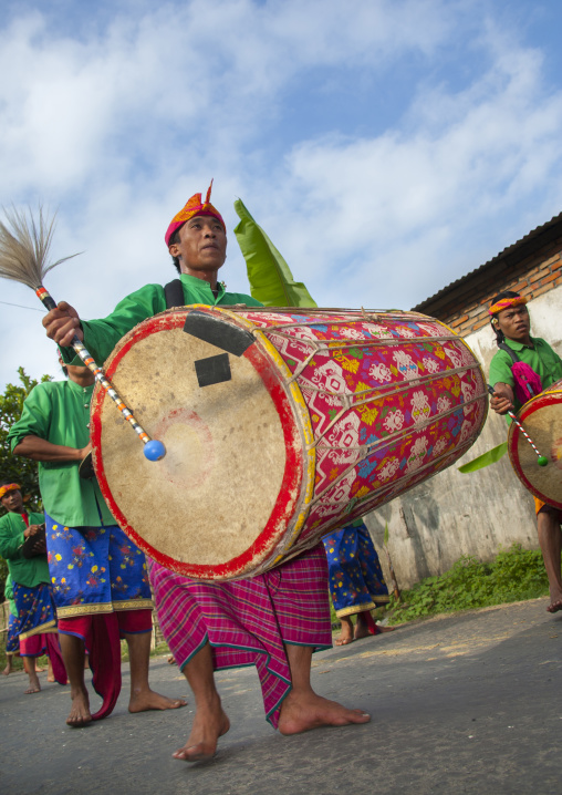 Man Banging A Huge Drum During A Wedding Parade, Mataram, Lombok Island, Indonesia