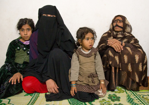 bandari women wearing mask burqa and veil with children, Qeshm Island, Salakh, Iran
