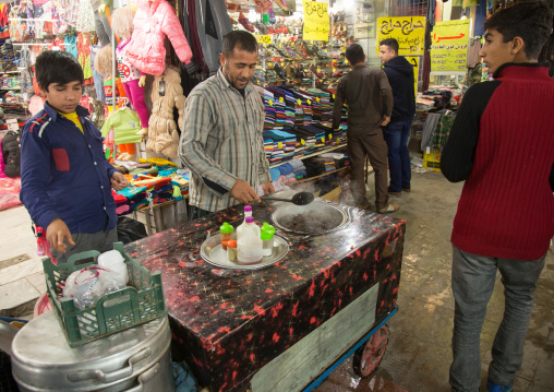 man selling food in the bazaar with a mobile food stall, Hormozgan, Bandar Abbas, Iran