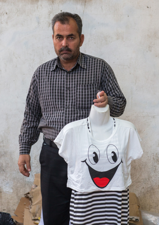 bandari man selling a shirt with a smiley, Hormozgan, Bandar Abbas, Iran