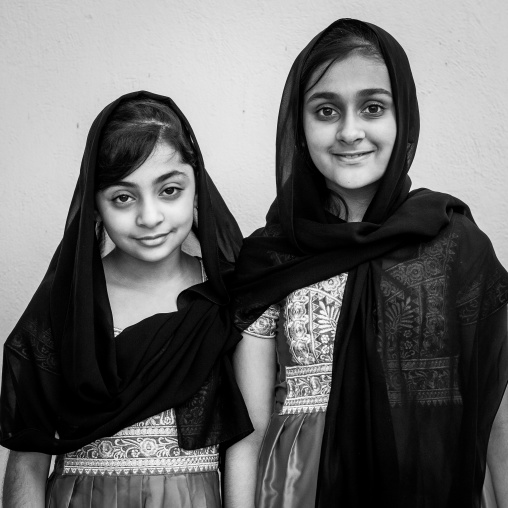 portrait of two young girls in traditional bandari clothing during a ceremony, Hormozgan, Bandar-e Kong, Iran