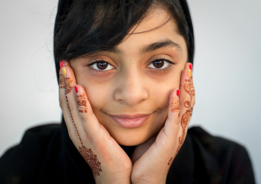 portrait of a young girl with henna tattooed hands in traditional bandari clothing during a wedding ceremony, Hormozgan, Bandar-e Kong, Iran