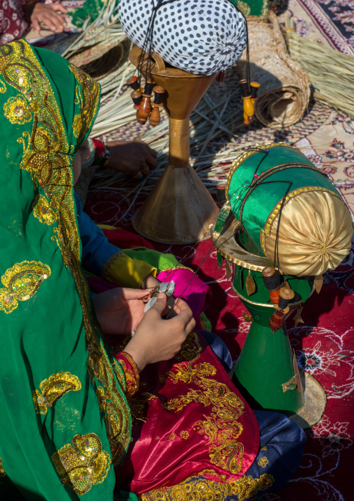 girls weaving a belt, Hormozgan, Bandar-e Kong, Iran