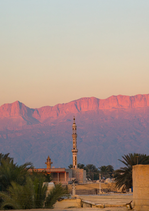 mosque in front of the moutain at sunset, Hormozgan, Kushkenar, Iran