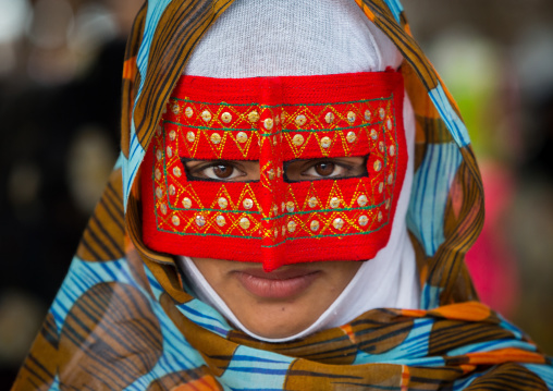 a bandari woman wearing a traditional mask called the burqa at panjshambe bazar thursday market, Hormozgan, Minab, Iran