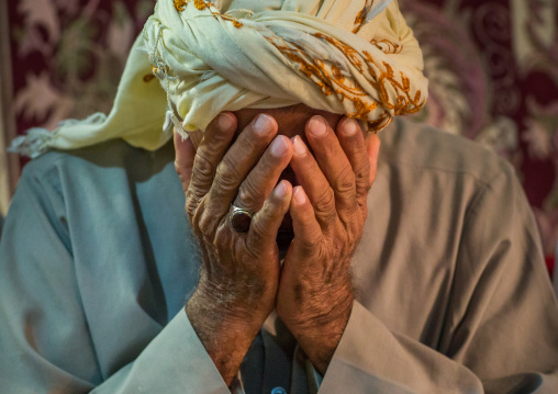 muslim man praying during wedding celebrations, Qeshm Island, Tabl , Iran