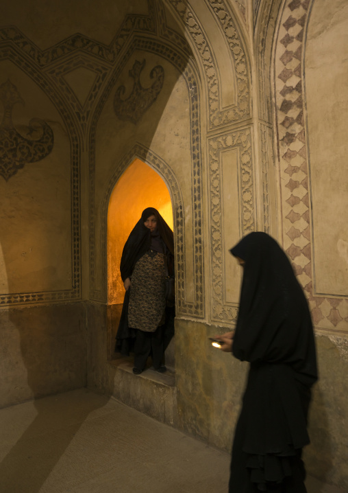 Veiled woman in the karim khan fort bath, Fars province, Shiraz, Iran