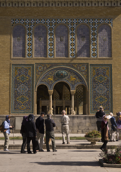 Western tourists in front of the richly-decorated walls of the golestan palace, Shemiranat county, Tehran, Iran