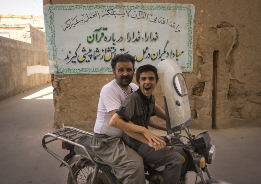 Man and son on motorbike, Isfahan province, Kashan, Iran