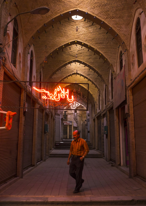 Man walking in the bazaar early in the morning, Isfahan province, Kashan, Iran
