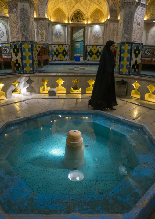 Woman passing in sultan amir ahmad bathhouse, Isfahan province, Kashan, Iran