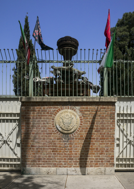 Defaced american seal on the wall of the former american embassy, Shemiranat county, Tehran, Iran