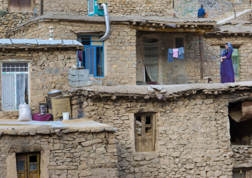Woman Standing On A Terrace Of The Old Kurdish Village Of Palangan, Iran