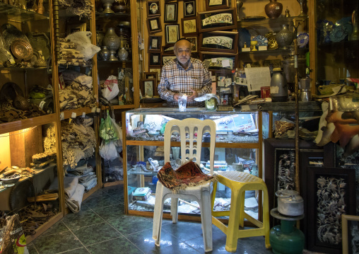 Old iranian man in his souvenirs shop, Isfahan Province, Isfahan, Iran
