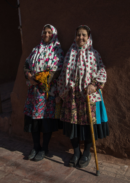 Iranian women wearing traditional floreal chadors in zoroastrian village, Natanz County, Abyaneh, Iran