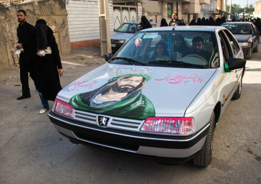 The portrait of Abbas Bin Ali on a Peugeot car for Ashura celebrations, Lorestan Province, Khorramabad, Iran