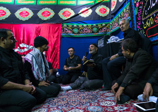 Iranian shiite muslim men having a nazri charity diner during Muharram before Ashura celebrations, Central County, Theran, Iran