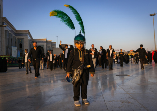 Child dressed as iman Hussein in a procession during Muharram celebrations in Fatima al-Masumeh shrine, Central County, Qom, Iran
