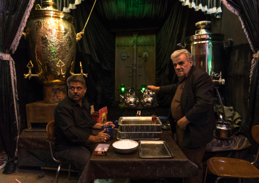 Shiite men offering free tea as nazri during Muharram, Isfahan Province, Kashan, Iran