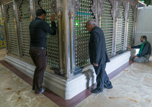 Men praying in the Shrine of sultan Ali, Kashan County, Mashhad-e Ardahal, Iran