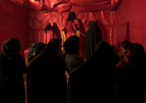 Women looking at a display of Iman Hussein life during Muharram, Lorestan Province, Khorramabad, Iran