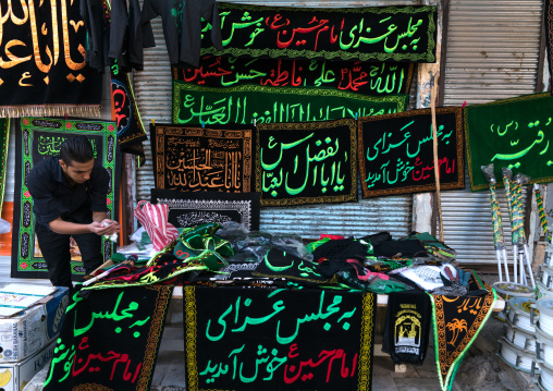 Vendor selling flags and banners for Muharram and Ashura , Lorestan Province, Khorramabad, Iran