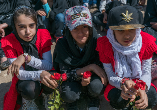 Iranian girls wearing caps with i love jesus slogan and a marijuana leaf, Lorestan Province, Khorramabad, Iran