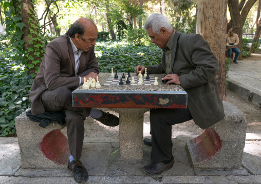 Iranian men playing chess in a park, Isfahan Province, Isfahan, Iran