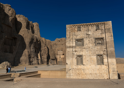 Tourists in front of the tower knows as the kabah of zoroaster in Naqsh-e Rustam necropolis, Fars Province, Shiraz, Iran