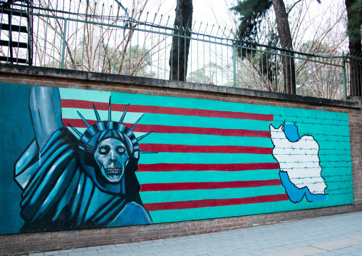 anti-american mural propoganda slogan depict statue liberty skeleton on the wall of the former united states embassy, Central district, Tehran, Iran