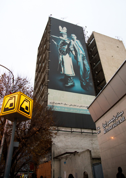 giant billboard showing barack obama with shmer, a villain in shia islam, on valiasr square, Central district, Tehran, Iran