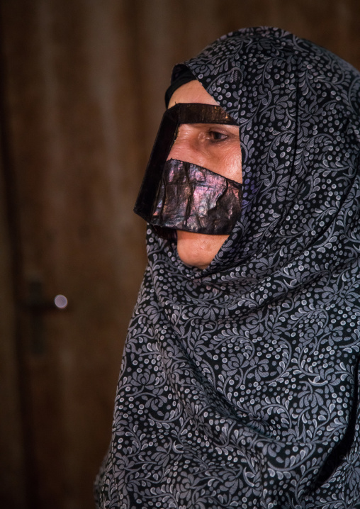 a bandari woman wearing a traditional mask called the burqa, Qeshm Island, Tabl , Iran