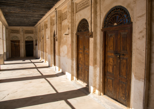 old doors in a house courtyard, Hormozgan, Bandar-e Kong, Iran