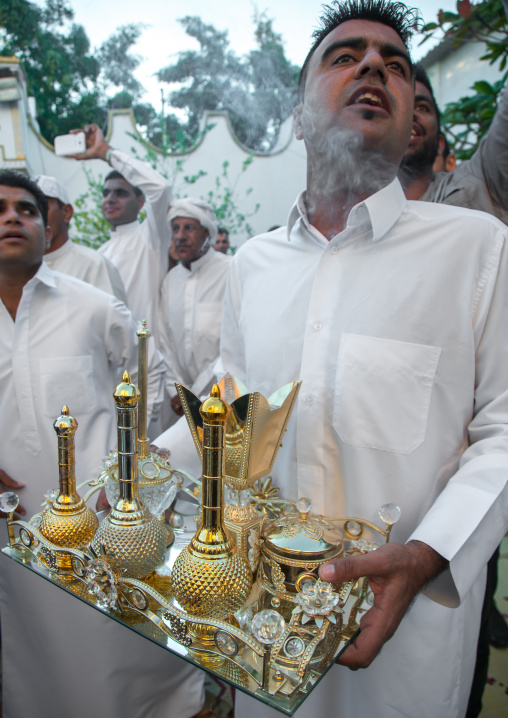 man carrying incense and perfumes for the wedding ceremony, Hormozgan, Bandar-e Kong, Iran