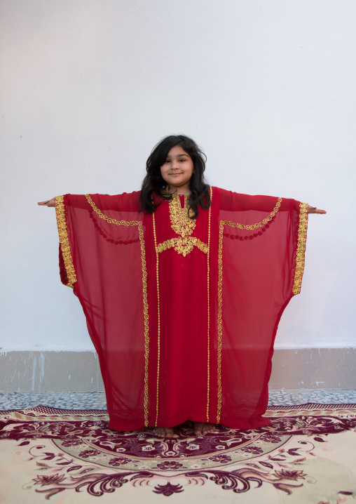young girl in traditional clothing during a wedding ceremony, Hormozgan, Bandar-e Kong, Iran