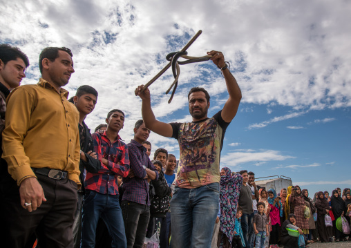 man showing a snake to the spectators, Hormozgan, Minab, Iran