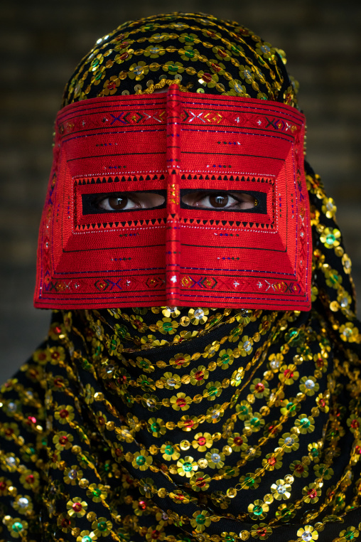 a bandari woman wearing a traditional mask called the burqa, Hormozgan, Minab, Iran