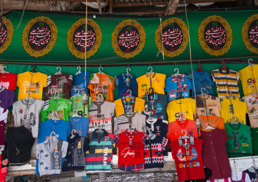 made in china shits below shia banners in ganjali bazaar, Central County, Kerman, Iran
