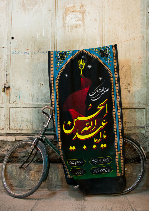 bicycle in the bazaar with an ashura banner, Central County, Kerman, Iran